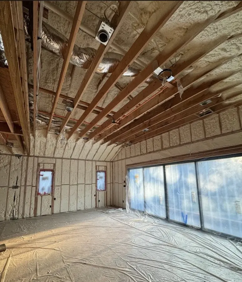 Interior walls and ceiling insulated with spray foam during new construction in Shawnee